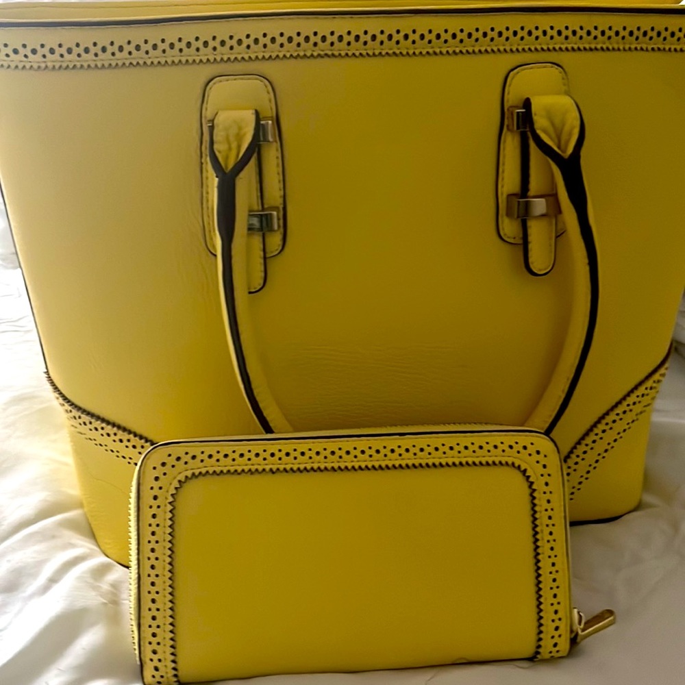 Handbag with matching clutch and straps. Can be worn with or without